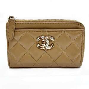 CHANEL Brown Lambskin Leather Logo Mini Bag